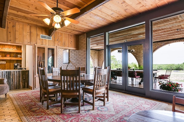6290 Stokes Rd, San Angelo, TX 76904 - dining space featuring wooden ceiling, french doors, ceiling fan, and wooden walls