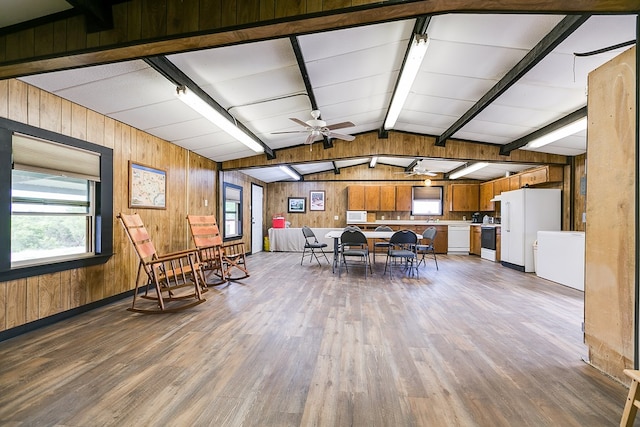 6290 Stokes Rd, San Angelo, TX 76904 - dining space with wood finished floors, wooden walls, plenty of natural light, and ceiling fan