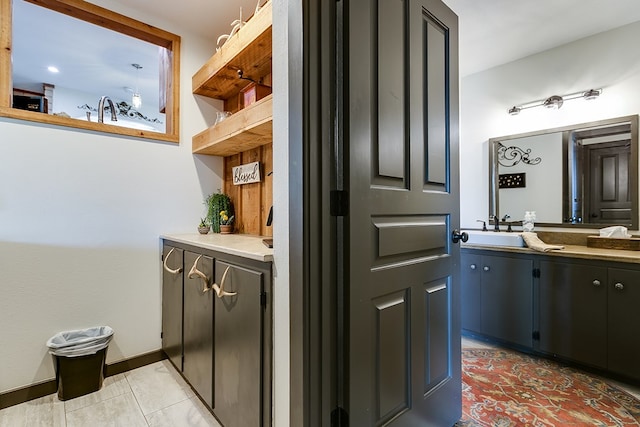 6290 Stokes Rd, San Angelo, TX 76904 - bathroom featuring vanity, tile patterned flooring, and baseboards