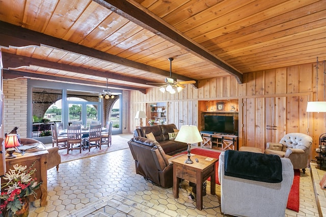 6290 Stokes Rd, San Angelo, TX 76904 - living area featuring wood walls, wood ceiling, beam ceiling, a chandelier, and ceiling fan