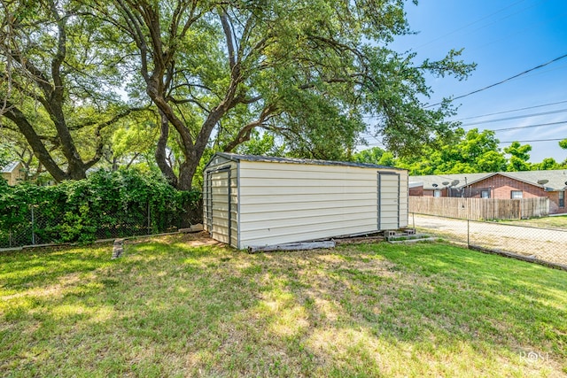 view of outdoor structure featuring a yard