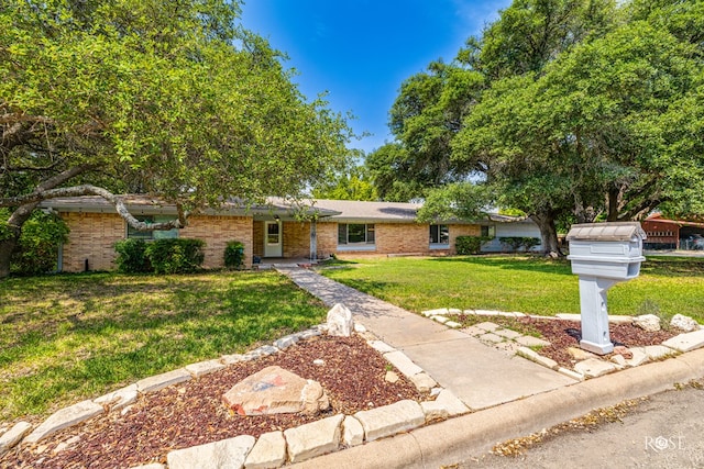 single story home featuring a front yard