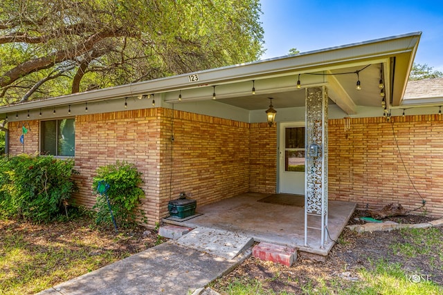 doorway to property featuring a patio