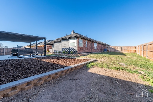 view of yard with a fenced backyard and a patio area