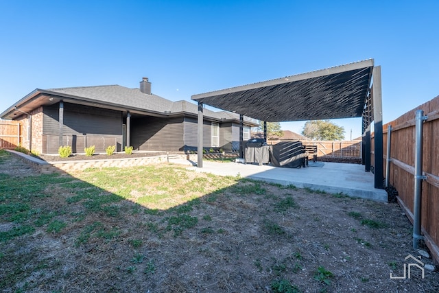 view of yard featuring a patio and a fenced backyard