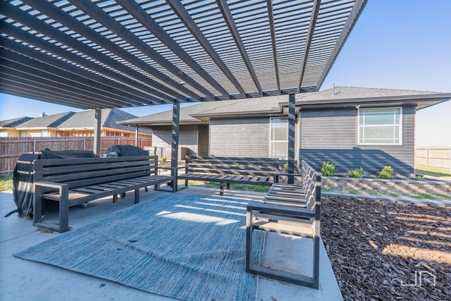 view of patio featuring a pergola and fence