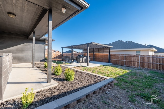 view of yard with a fenced backyard and a patio area