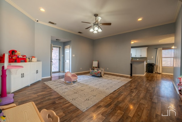 playroom featuring dark wood finished floors, visible vents, baseboards, and a wealth of natural light