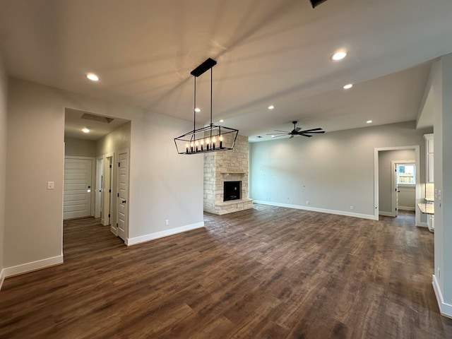 3611 Clearview Dr, San Angelo, TX 76904 - unfurnished living room with a ceiling fan, dark wood-type flooring, recessed lighting, and a fireplace