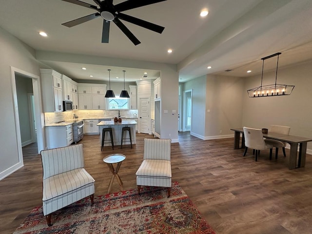 3611 Clearview Dr, San Angelo, TX 76904 - living area featuring a ceiling fan, recessed lighting, and dark wood-type flooring