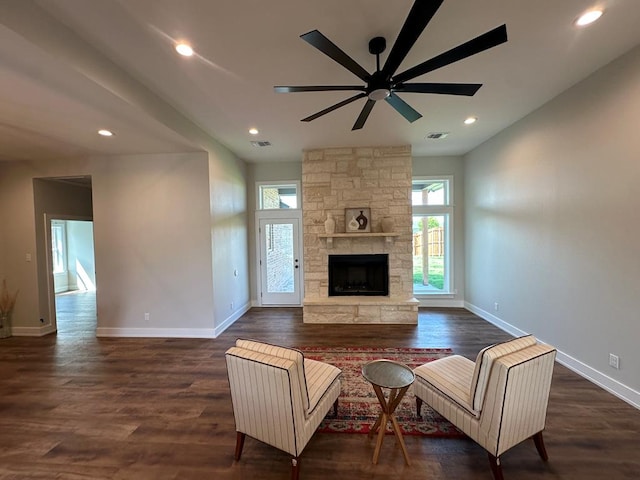3611 Clearview Dr, San Angelo, TX 76904 - living area with ceiling fan, a stone fireplace, dark wood-style flooring, and recessed lighting