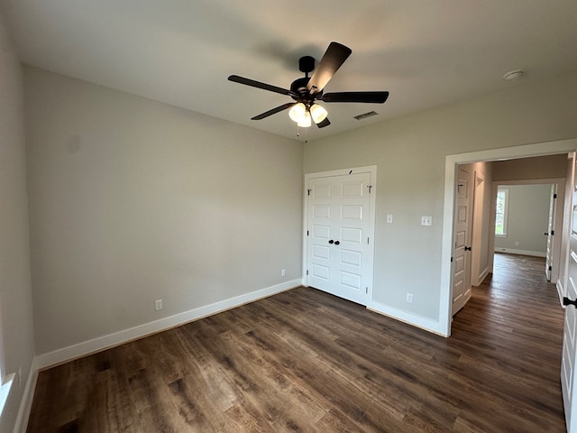 3611 Clearview Dr, San Angelo, TX 76904 - unfurnished bedroom with dark wood-style floors and a ceiling fan