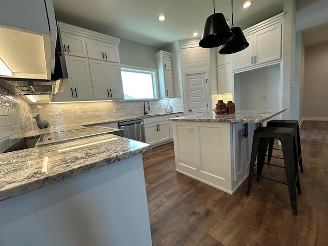 3611 Clearview Dr, San Angelo, TX 76904 - kitchen with dishwasher, a kitchen island, light stone countertops, decorative backsplash, and dark wood-style flooring