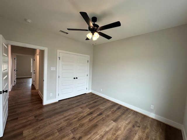3611 Clearview Dr, San Angelo, TX 76904 - unfurnished bedroom with dark wood-style flooring, a closet, and ceiling fan