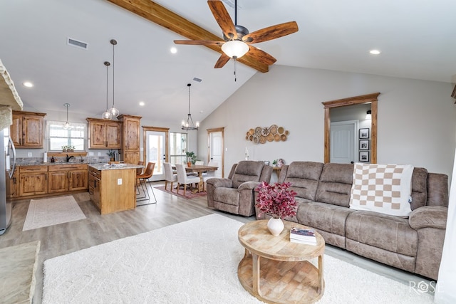 living area featuring visible vents, ceiling fan, beamed ceiling, light wood-style flooring, and recessed lighting