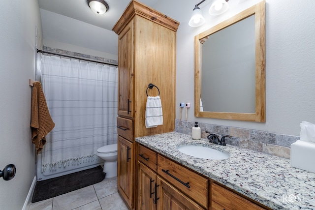 bathroom with tile patterned floors, toilet, curtained shower, and vanity