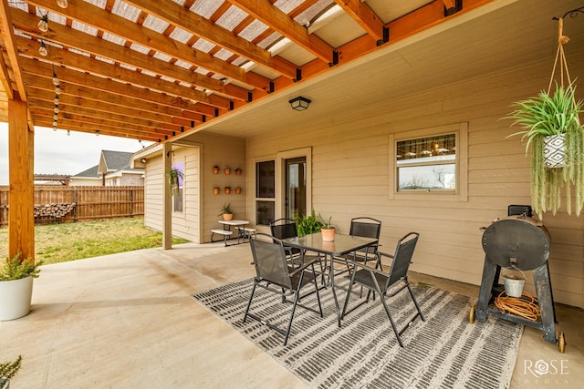 view of patio / terrace with outdoor dining space and fence