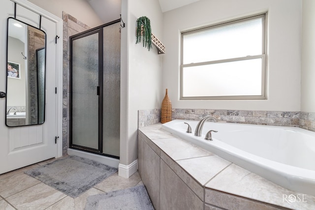 full bathroom with tile patterned flooring, a shower stall, and a bath