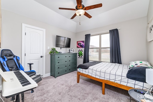 bedroom with baseboards, lofted ceiling, light colored carpet, and ceiling fan