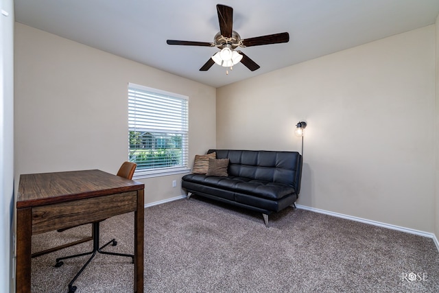 carpeted office featuring ceiling fan