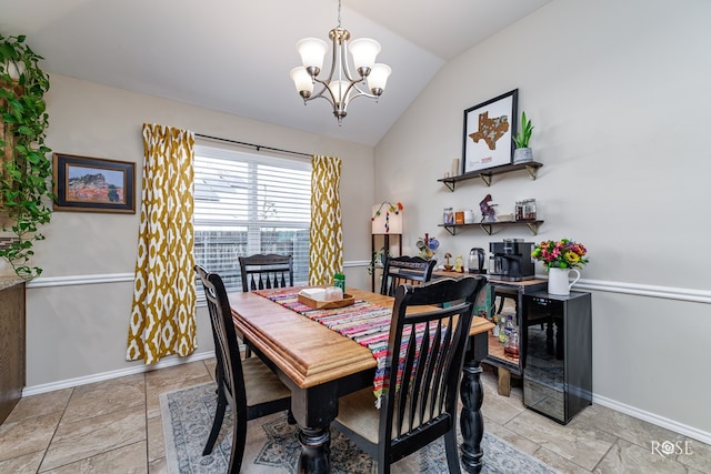 dining room with vaulted ceiling and a chandelier