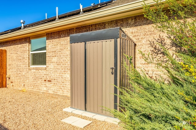 view of property exterior with an outbuilding