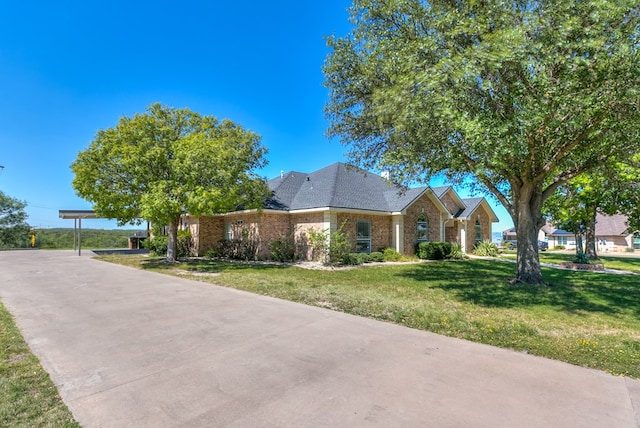 ranch-style house with a front yard