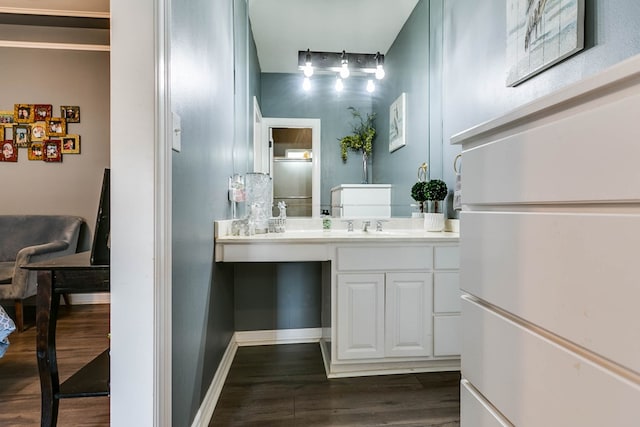 bathroom featuring vanity and hardwood / wood-style flooring