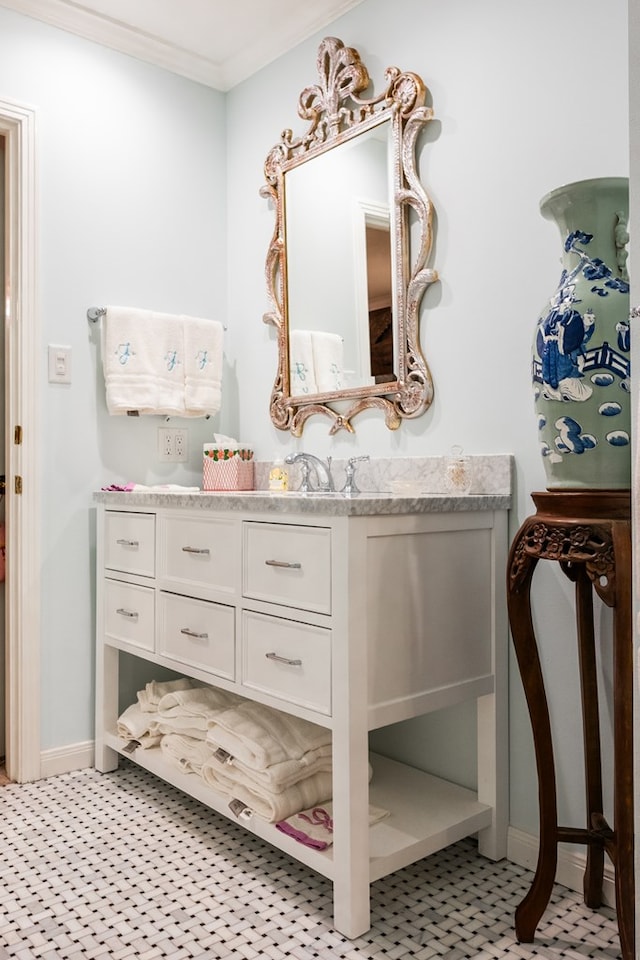 bathroom with vanity and ornamental molding