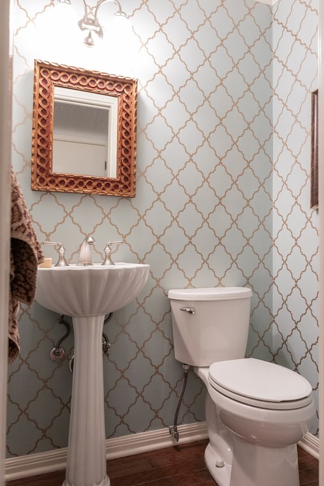 bathroom featuring toilet and hardwood / wood-style floors