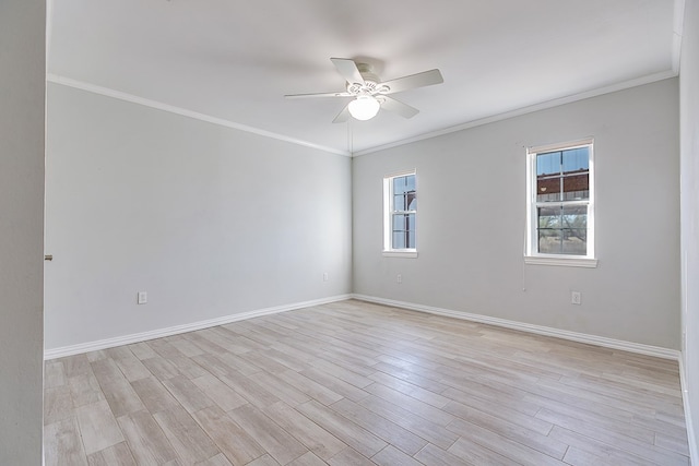 empty room featuring crown molding, ceiling fan, and light hardwood / wood-style floors