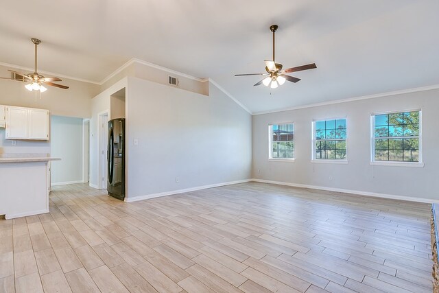 unfurnished living room with lofted ceiling, crown molding, ceiling fan, and light wood-type flooring