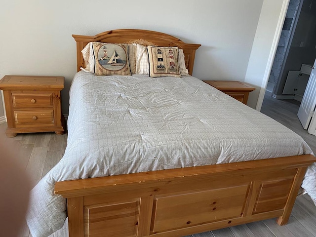 bedroom with light hardwood / wood-style floors