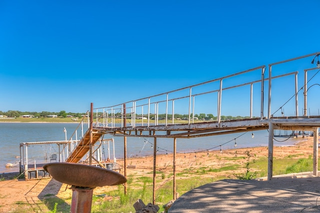 exterior space featuring a water view and a dock