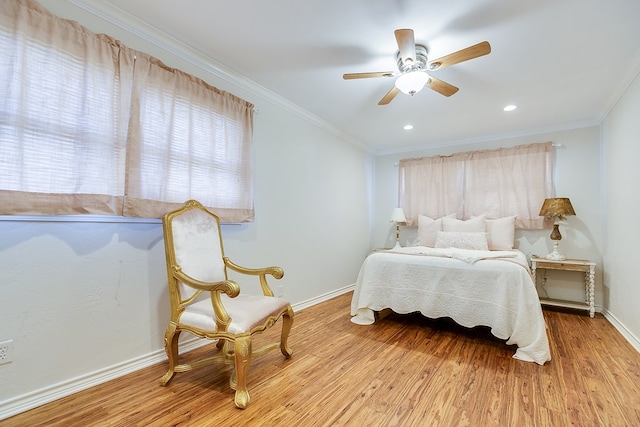 bedroom featuring crown molding, ceiling fan, recessed lighting, baseboards, and wood finished floors