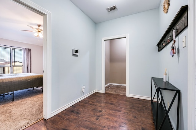 hallway featuring dark hardwood / wood-style flooring