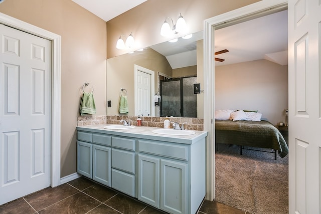 bathroom featuring ceiling fan, lofted ceiling, an enclosed shower, and vanity