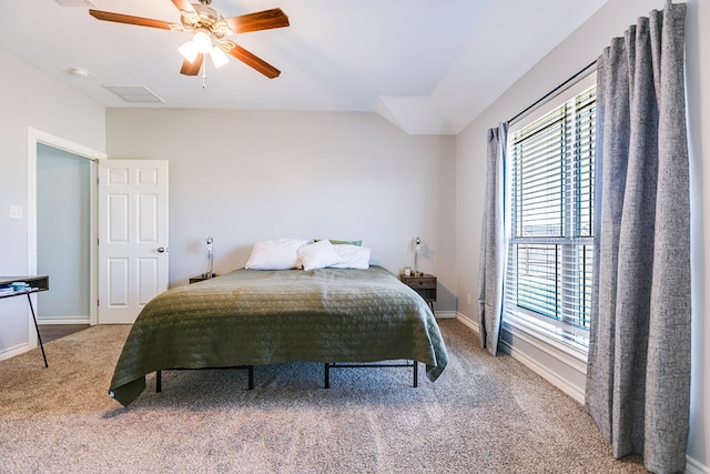 carpeted bedroom featuring ceiling fan and lofted ceiling