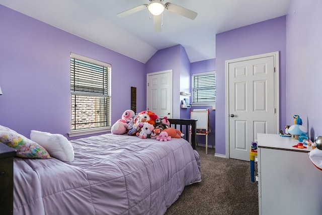 bedroom featuring ceiling fan, lofted ceiling, and dark colored carpet