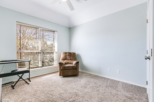 sitting room featuring carpet and ceiling fan