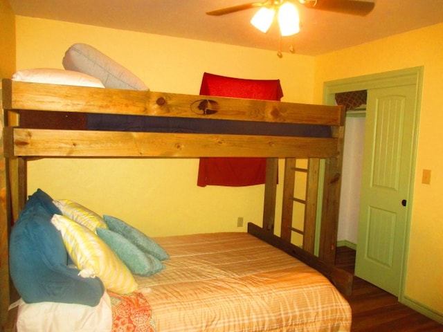 bedroom with hardwood / wood-style flooring and ceiling fan