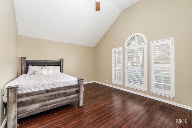 bedroom with hardwood / wood-style flooring, ceiling fan, and lofted ceiling