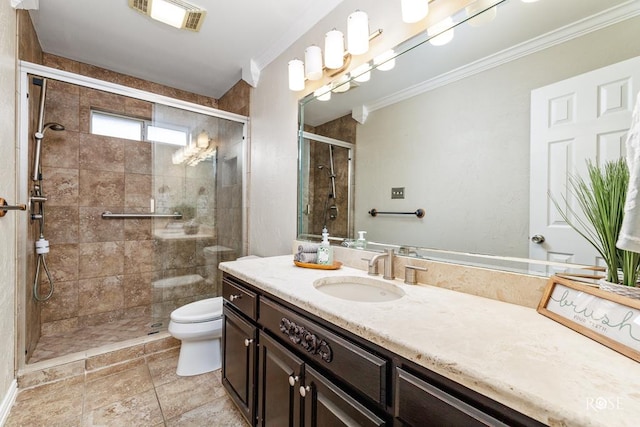 bathroom featuring vanity, ornamental molding, toilet, and walk in shower