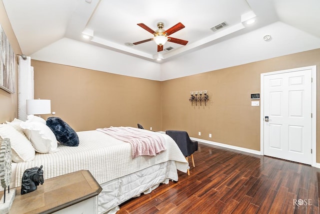 bedroom with a raised ceiling, ceiling fan, lofted ceiling, and dark hardwood / wood-style flooring