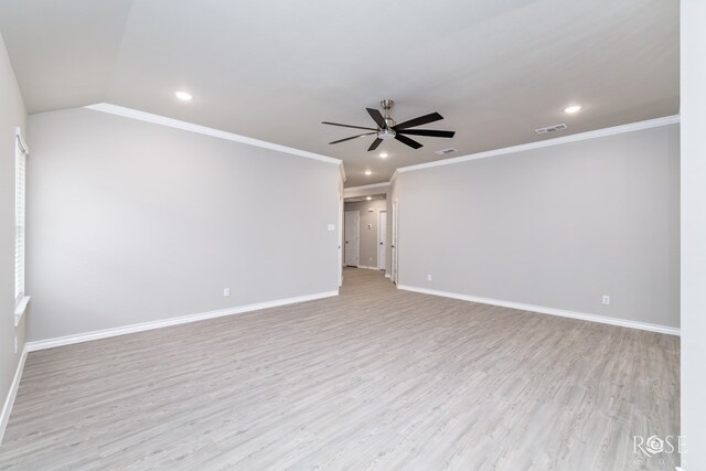 empty room with ornamental molding, a chandelier, hardwood / wood-style floors, and a wealth of natural light