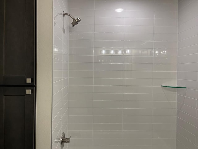 bathroom with a tile shower