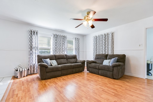 living room featuring hardwood / wood-style flooring and ceiling fan