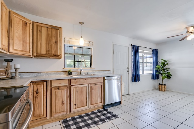 kitchen with sink, light tile patterned floors, pendant lighting, ceiling fan, and stainless steel appliances