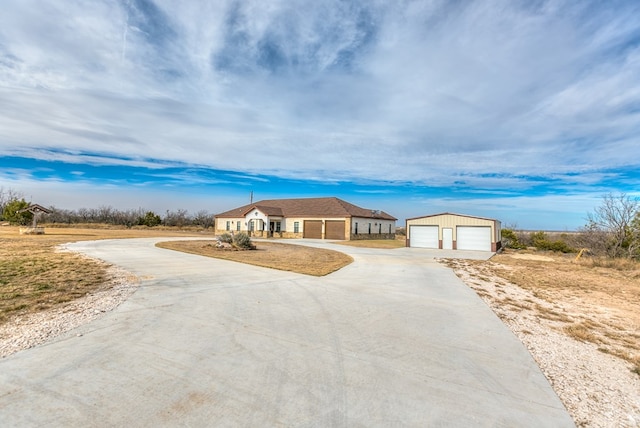 ranch-style house featuring a garage