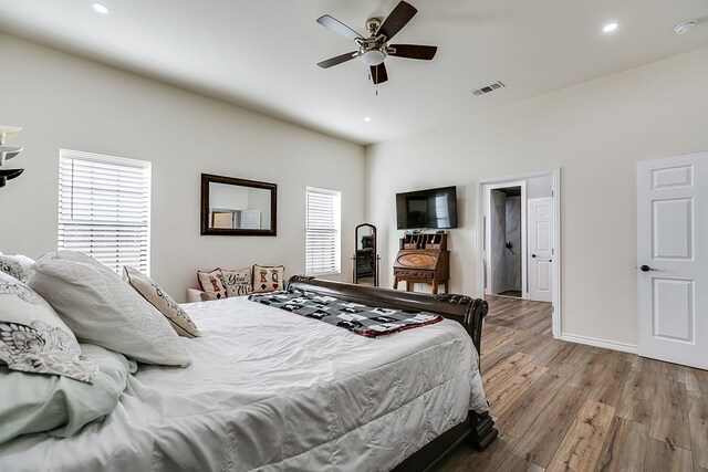 bedroom with hardwood / wood-style floors and ceiling fan